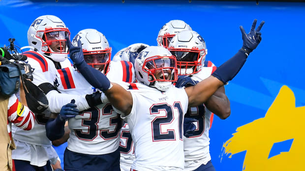 New England Patriots safety Adrian Phillips (21) celebrates after intercepting a pass and running it back for a touchdown during the second half of an NFL football game against the Los Angeles Chargers Sunday, Oct. 31, 2021, in Inglewood, CA